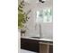 Close up on kitchen sink and faucet, modern white tile backsplash and window at 3637 Eaglerock Dr, Atlanta, GA 30340