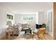 Bright living room features cozy seating, hardwood floors, and natural light at 3637 Eaglerock Dr, Atlanta, GA 30340