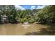 Serene pond with a fountain surrounded by lush greenery at 1371 Keys Lake Ne Dr, Brookhaven, GA 30319