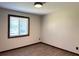 Bedroom with wood-look vinyl plank flooring and wood trim window at 1449 Albans Ct, Lithonia, GA 30058