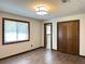 A bedroom featuring vinyl floors, a closet, a window, and neutral-colored walls at 1449 Albans Ct, Lithonia, GA 30058