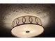 Close up shot of a decorative ceiling light fixture and textured ceiling at 1449 Albans Ct, Lithonia, GA 30058