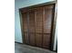 Hall closet with wood bi-fold doors at 1449 Albans Ct, Lithonia, GA 30058