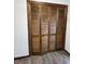Brown wood, bi-fold closet doors at 1449 Albans Ct, Lithonia, GA 30058