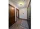 Inviting entryway with modern light fixture, new front door and attractive hardwood floors at 1449 Albans Ct, Lithonia, GA 30058