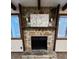 Close-up of stone fireplace and wood mantle at 1449 Albans Ct, Lithonia, GA 30058