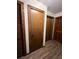 Hallway with wood plank flooring and a storage closet with a paneled door at 1449 Albans Ct, Lithonia, GA 30058