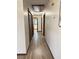 Hallway with wood trim and wood-look vinyl plank flooring at 1449 Albans Ct, Lithonia, GA 30058