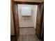 Open bi-fold doors to reveal laundry hook-ups and a cabinet at 1449 Albans Ct, Lithonia, GA 30058