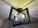 Stylish light fixture with a modern design and unique ceiling texture adds character to the home at 1449 Albans Ct, Lithonia, GA 30058