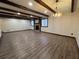 Spacious living room features stone fireplace, hardwood floors, and wooden ceiling beams at 1449 Albans Ct, Lithonia, GA 30058