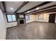 Spacious living room features a stone fireplace, hardwood floors and wooden ceiling beams at 1449 Albans Ct, Lithonia, GA 30058