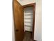 Open wood trim pantry door revealing shelving at 1449 Albans Ct, Lithonia, GA 30058