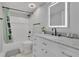 Bright bathroom features a modern vanity with a marble countertop and a sleek, illuminated mirror at 4150 Lower Roswell Rd, Marietta, GA 30068