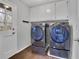 Convenient laundry room equipped with a washer, dryer, and storage cabinets at 4150 Lower Roswell Rd, Marietta, GA 30068