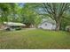Backyard featuring a carport and mature trees at 1610 Elm Ne St, Conyers, GA 30012