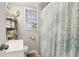 Small bathroom featuring a single sink vanity and a shower with a patterned curtain at 1610 Elm Ne St, Conyers, GA 30012
