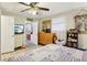 Bright bedroom with a TV, multiple closets, and view to bathroom at 1610 Elm Ne St, Conyers, GA 30012