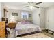 Bright bedroom with neutral walls, wood floors, and a comfortable bed at 1610 Elm Ne St, Conyers, GA 30012