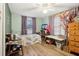Inviting bedroom with a cozy bed, wood floors, and plenty of natural light at 1610 Elm Ne St, Conyers, GA 30012