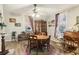 Dining room with a round table, wood floors, and a stained glass window adding charm at 1610 Elm Ne St, Conyers, GA 30012