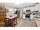 Bright kitchen with white cabinets, stainless steel appliances, and an adjacent dining area at 1610 Elm Ne St, Conyers, GA 30012