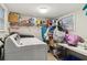 Laundry room featuring a washer, shelving, and ample space for storage at 1610 Elm Ne St, Conyers, GA 30012