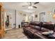 Spacious living room with a comfortable sofa, wood floors, and ample natural light at 1610 Elm Ne St, Conyers, GA 30012