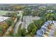 Aerial view of a neighborhood featuring well-maintained townhomes and manicured landscaping at 2452 Coosa Vly, Atlanta, GA 30339