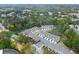 Aerial view of a neighborhood featuring well-maintained townhomes nestled among lush greenery at 2452 Coosa Vly, Atlanta, GA 30339