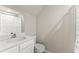 Small bathroom featuring a sink, toilet, and a shower with a curtain at 2452 Coosa Vly, Atlanta, GA 30339