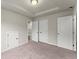 Neutral bedroom with carpeted floors, white doors, a walk-in closet, and recessed lighting at 2452 Coosa Vly, Atlanta, GA 30339