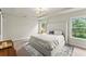 Tranquil bedroom featuring a king-size bed and tray ceiling at 2452 Coosa Vly, Atlanta, GA 30339