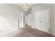Bedroom with carpet flooring, standard closet and geometric light fixture at 2452 Coosa Vly, Atlanta, GA 30339