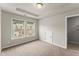 Neutral bedroom with carpet, tray ceiling, and two windows for natural light at 2452 Coosa Vly, Atlanta, GA 30339