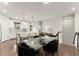 Open dining area featuring a modern table, stylish lighting, and seamless access to the kitchen at 2452 Coosa Vly, Atlanta, GA 30339