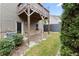 Back exterior of the house with wood siding, small porches, and a manicured lawn at 2452 Coosa Vly, Atlanta, GA 30339