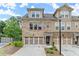 Charming townhome with well-maintained landscaping, a private garage, and a welcoming facade at 2452 Coosa Vly, Atlanta, GA 30339