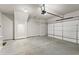 Spacious garage featuring a concrete floor, ample storage space, and a functional garage door at 2452 Coosa Vly, Atlanta, GA 30339