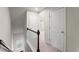 Upstairs hallway featuring carpet and an abundance of natural light at 2452 Coosa Vly, Atlanta, GA 30339