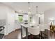 Beautiful kitchen with granite counters, stainless steel appliances, island seating, and custom lighting at 2452 Coosa Vly, Atlanta, GA 30339