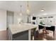 Spacious kitchen island featuring granite counters, seating, and modern pendant lighting at 2452 Coosa Vly, Atlanta, GA 30339