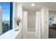 Bathroom featuring a white shower with glass doors, and a large window with cityscape views at 75 14Th Ne St # 3820, Atlanta, GA 30309