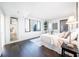 Bright bedroom features a dark wood floor, and a window with cityscape views at 75 14Th Ne St # 3820, Atlanta, GA 30309