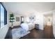 Bright bedroom with stylish decor, dark floors, and a large window with cityscape views at 75 14Th Ne St # 3820, Atlanta, GA 30309