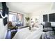 Bright bedroom features a private balcony with city views, modern decor, and an open layout at 75 14Th Ne St # 3820, Atlanta, GA 30309