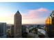 Expansive city skyline view during sunset, featuring modern high-rise buildings and colorful sky at 75 14Th Ne St # 3820, Atlanta, GA 30309