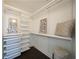 Walk-in closet with custom shelving and storage solutions, for easy organization at 75 14Th Ne St # 3820, Atlanta, GA 30309