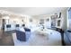 Open-concept living area flowing into a modern kitchen with an adjacent walkout balcony at 75 14Th Ne St # 3820, Atlanta, GA 30309