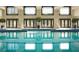 Indoor swimming pool area with multiple lounge chairs and bright windows at 75 14Th Ne St # 3820, Atlanta, GA 30309